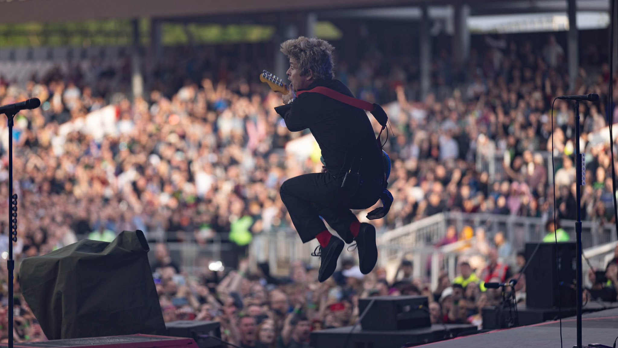 A crowd enjoying a Green Day concert in 2025